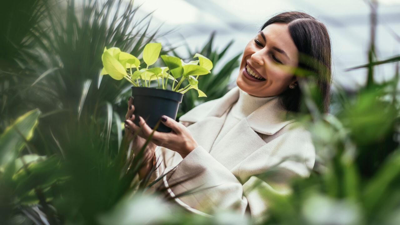 Woman buying herself a plant.