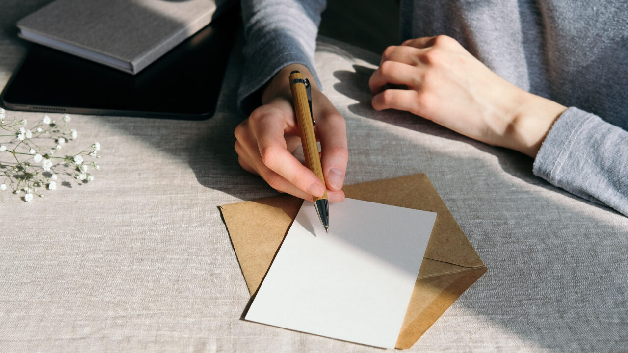 Woman writing letter.