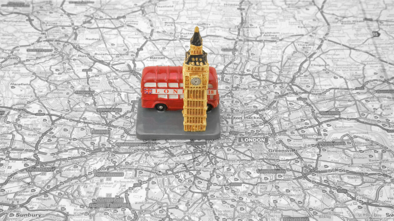 Model of double decker bus on london map.